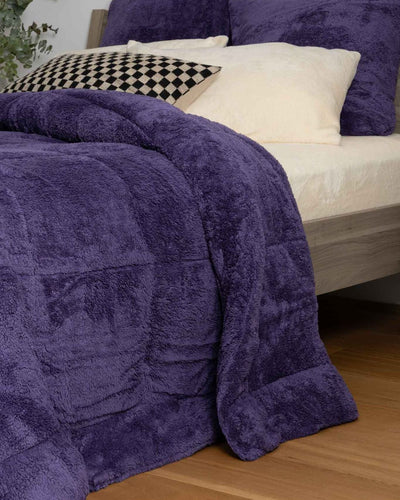Detail shot of the Morgan and Reid Mulberry Purple Snuggle Fleece European Pillowcase Pair on a pillow