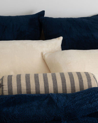 Morgan and Reid Pagnet Blue Snuggle Fleece European Pillowcase Pair on bed with coordinating bedding