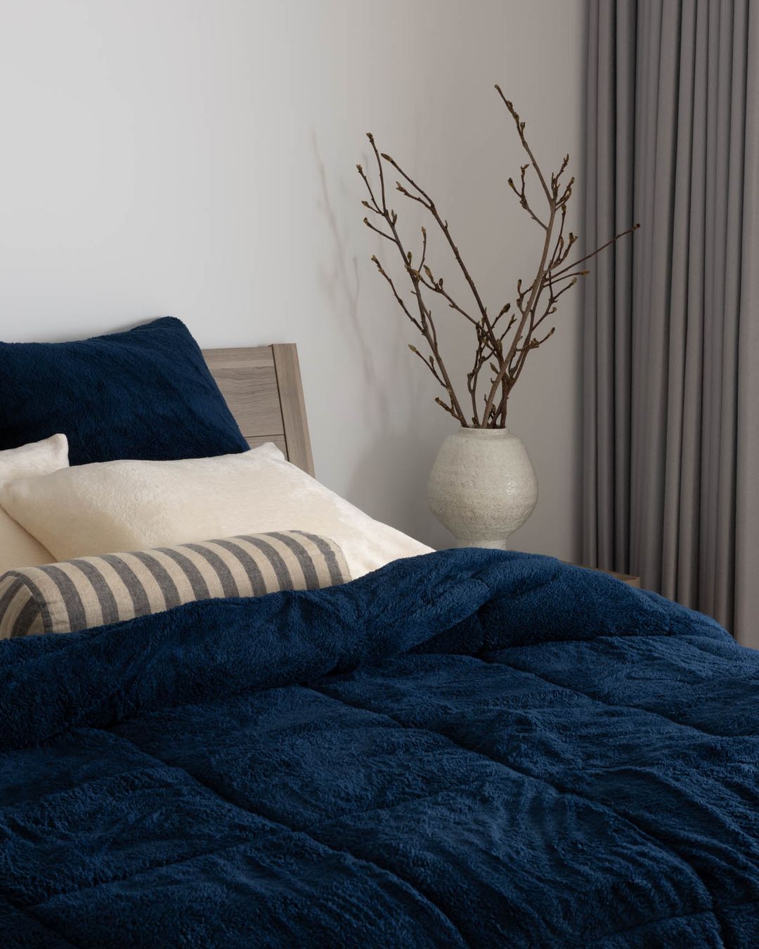 Morgan and Reid Pagnet Blue Snuggle Fleece European Pillowcase Pair in a bedroom lifestyle setting