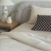 vanilla corduroy comforter on bed spanning video