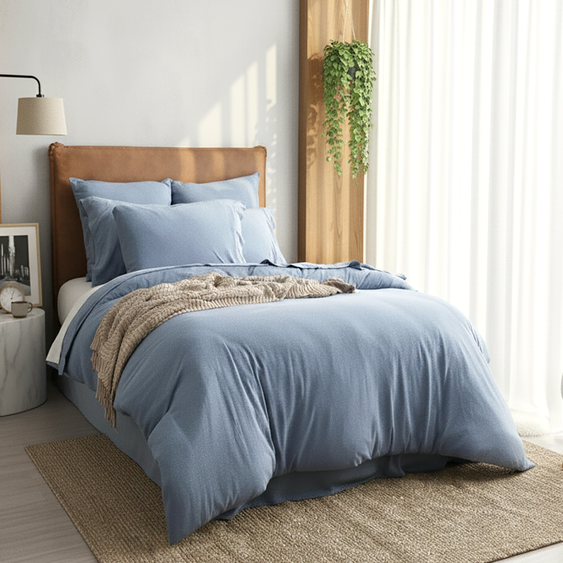 Relaxed bedroom featuring Renee Taylor Ink Jersey Quilt Cover and neutral decor.