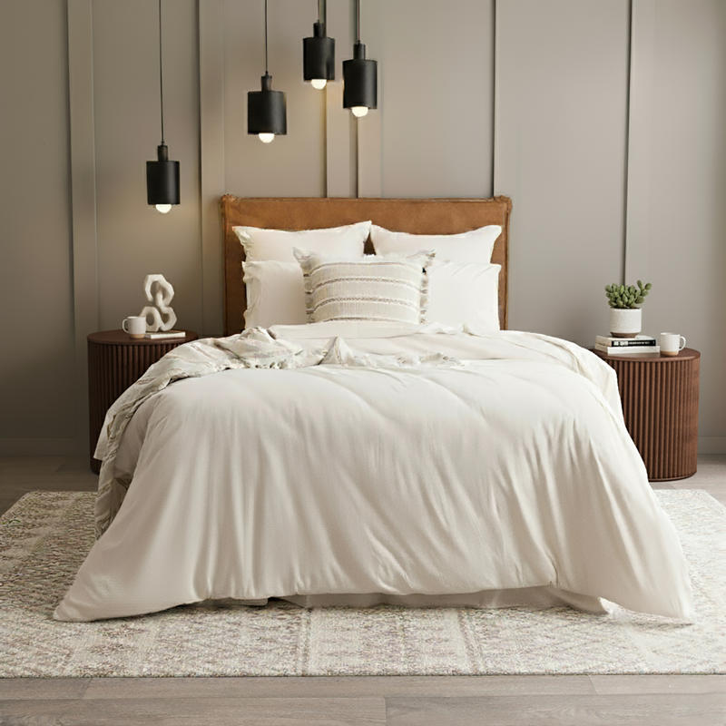 Styled bed featuring Renee Taylor Oatmeal European Pillowcase with matching jersey bedding.