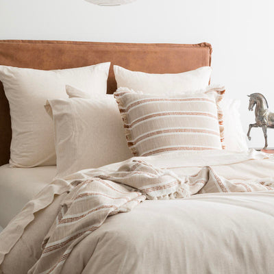 Styled bed featuring Renee Taylor Oatmeal European Pillowcase with matching jersey bedding.