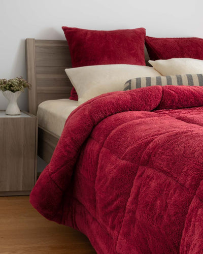 Morgan and Reid Rhubarb Snuggle Fleece European Pillowcase Pair on bed with coordinating bedding