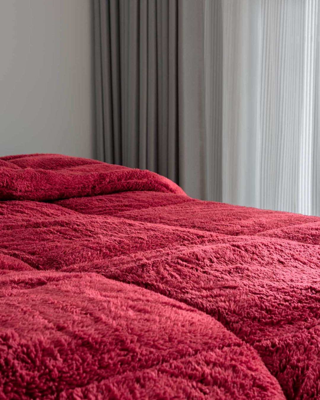 Overhead view of the Morgan and Reid Rhubarb Snuggle Fleece Comforter Set on a made bed