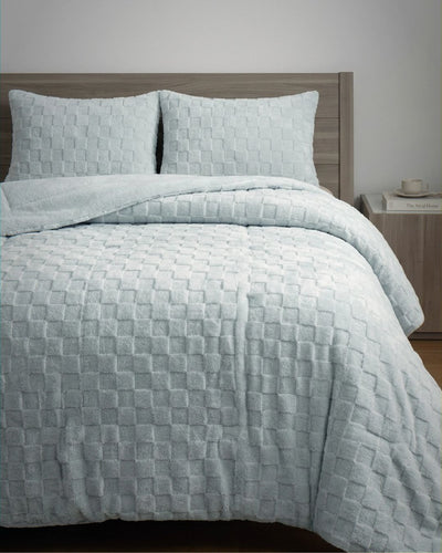 Soft Blue Checkered Snuggle Fleece Comforter Set styled on bed with matching pillow shams, square texture detail