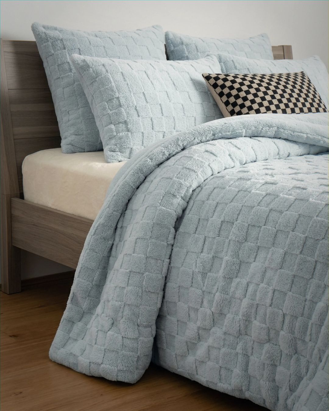 Soft Blue Checkered Snuggle Fleece Comforter Set styled on bed with matching shams and checkered accent pillow.