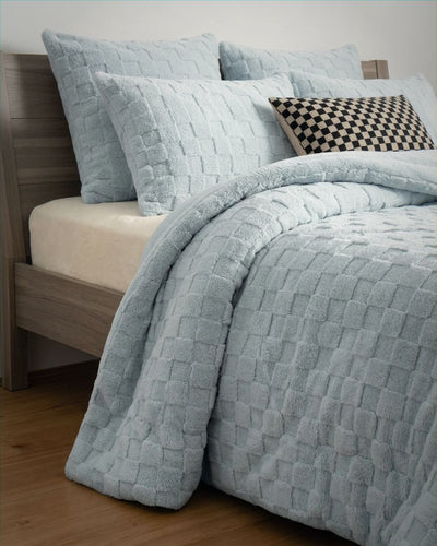 Soft Blue Checkered Snuggle Fleece Comforter Set styled on bed with matching shams and checkered accent pillow.