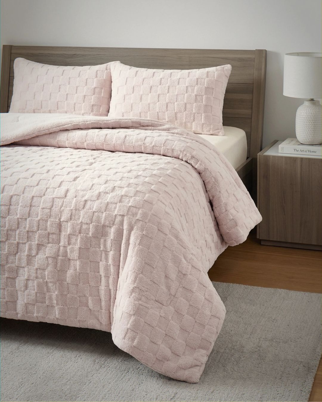 Soft Pink Checkered Snuggle Fleece Comforter Set styled on bed with matching shams, cozy textured squares detail